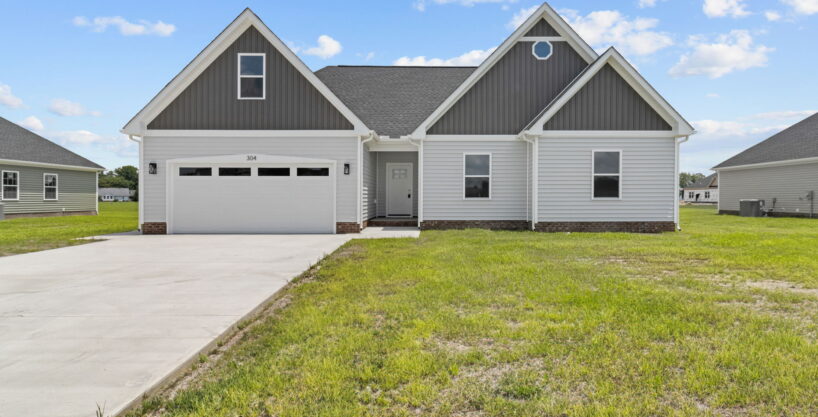 The Vanity II model home by HomeLink in Tooley Harbor, Elizabeth City, NC. A single-story, 3-bedroom new construction home with gray siding and a 2-car garage.