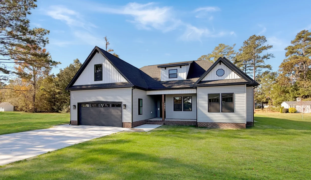 Exterior of The Georgetown new construction home in Elizabeth City featuring gray siding and black trim.