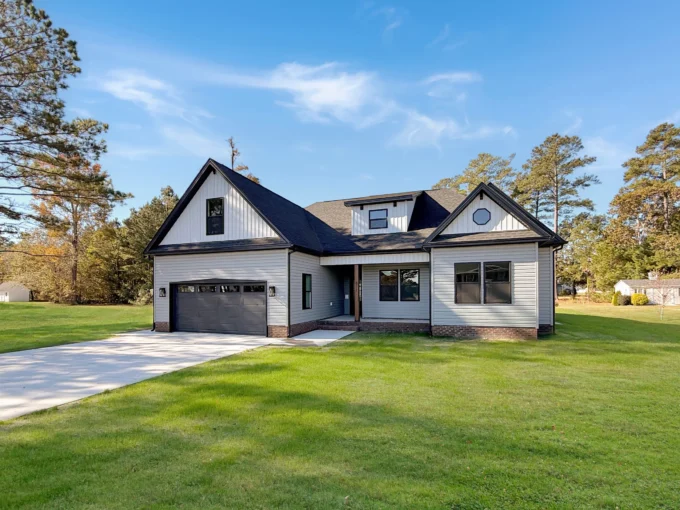 Exterior of The Georgetown new construction home in Elizabeth City featuring gray siding and black trim.