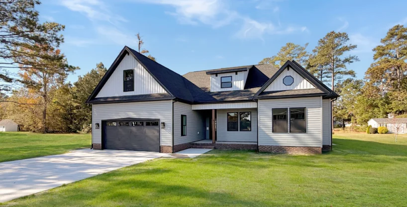 Exterior of The Georgetown new construction home in Elizabeth City featuring gray siding and black trim.