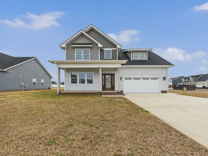 Exterior view of The San Lucas, a gray two-story new construction house with a white garage in Elizabeth City, NC.